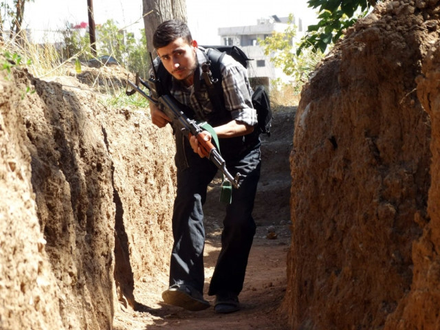 a free syrian army fighter moves along a trench with his weapon to avoid forces loyal to syria 039 s president bashar al assad in eastern al ghouta near damascus photo reuters a free syrian army fighter moves along a trench with his weapon to avoid forces loyal to syria 039 s president bashar al assad in eastern al ghouta near damascus photo reuters