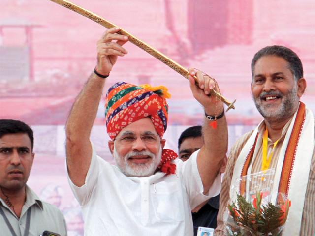 gujarat chief minister narendra modi raises a sword at bharatiya janata party rally after being named a prime ministerial candidate for elections due next year photo afp gujarat chief minister narendra modi raises a sword at bharatiya janata party rally after being named a prime ministerial candidate for elections due next year photo afp