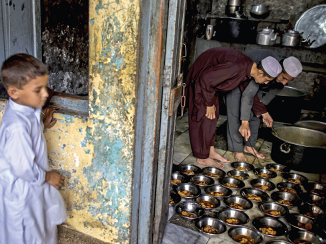 dinner time students prepare food for schoolmates at darul uloom haqqania photo reuters