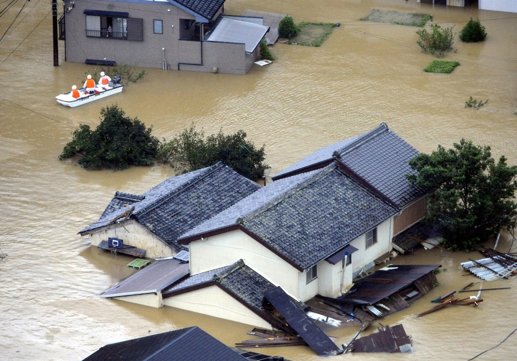 file photo of a houses submerged in flood water in western japan on september 4 2011 photo reuters