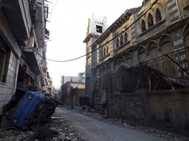 a damaged van is seen in front of an old damaged syriac catholic church in homs september 15 2013 photo reuters a damaged van is seen in front of an old damaged syriac catholic church in homs september 15 2013 photo reuters