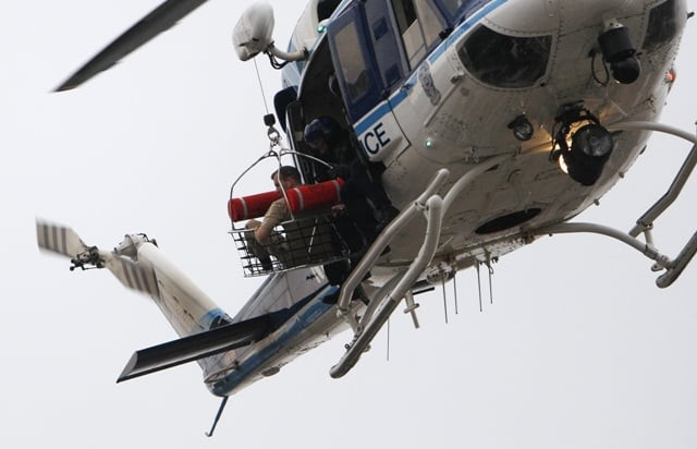 a police helicopter lifts what appears to be a shooting victim up as it hovers over a rooftop on the washington navy yard campus photo reuters a police helicopter lifts what appears to be a shooting victim up as it hovers over a rooftop on the washington navy yard campus photo reuters