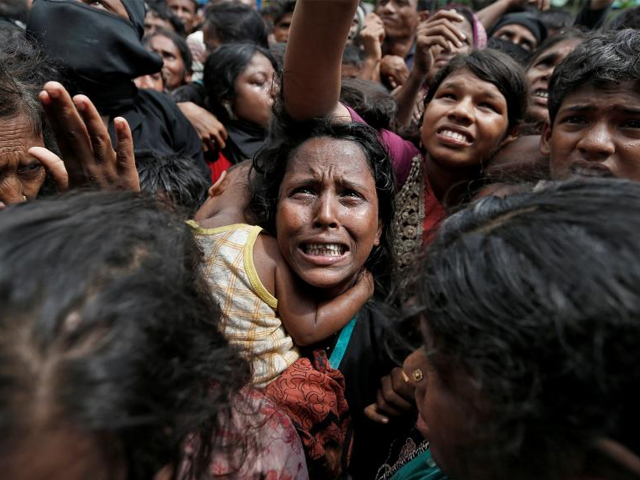 a woman reacts as rohingya refugees wait to receive aid in cox 039 s bazar bangladesh september 21 2017 photo reuters