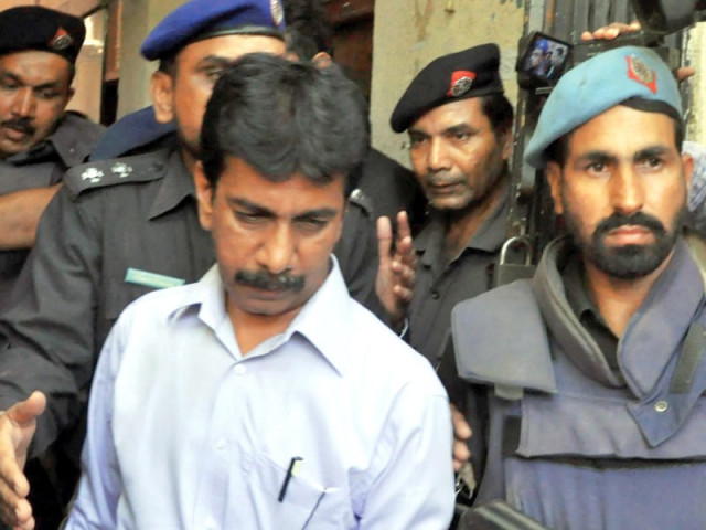 a file photo of mqm 039 s naddem hashmi being escorted by the police photo inp file a file photo of mqm 039 s naddem hashmi being escorted by the police photo inp file