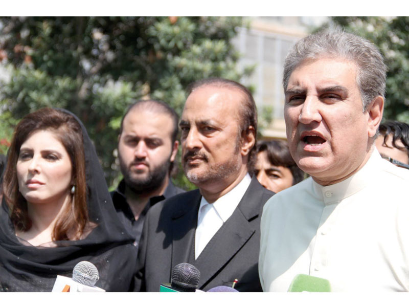 pti leaders shah mehmood qureshi and ayla malik along with their counsel babar awan talk to media outside the ecp office in islamabad photo inp