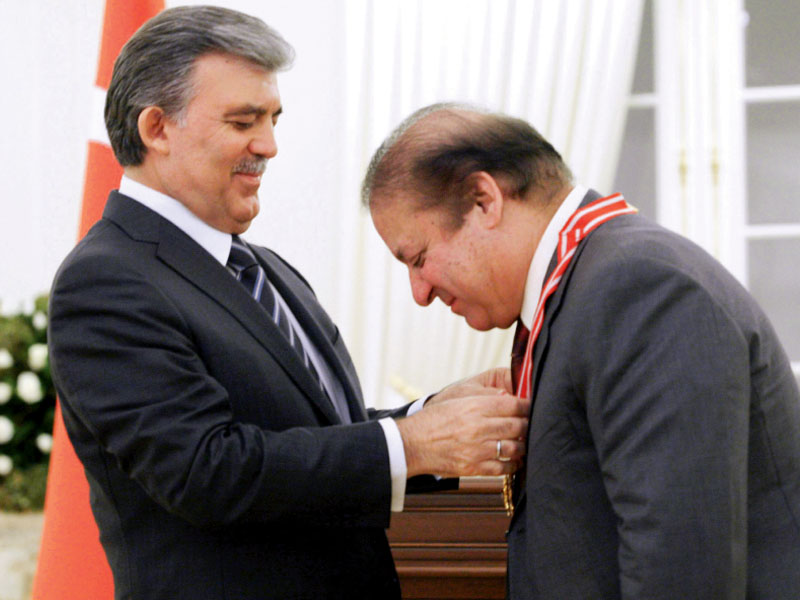 turkish president abdullah gul awards prime minister nawaz sharif with the jumhuriyet nishan during a ceremony in ankara photo afp