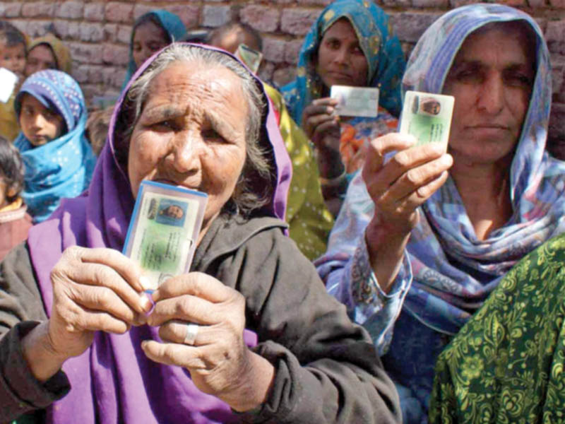 women being prevented to vote during na 25 di khan by elections photo inp