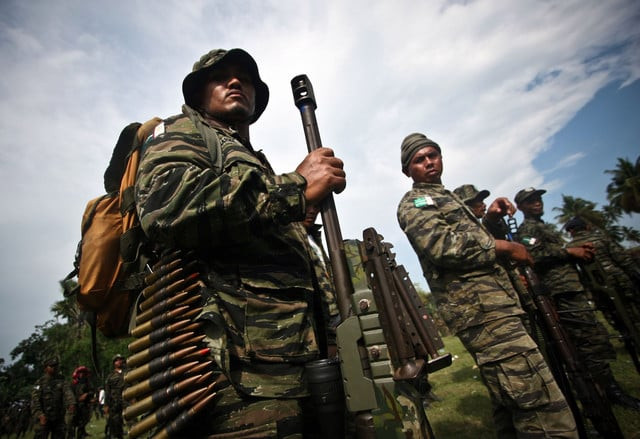 this photo taken on october 15 2012 shows members of the moro islamic liberation front standing in formation inside their camp in sultan kudarat town on the southern island of mindanao photo afp this photo taken on october 15 2012 shows members of the moro islamic liberation front standing in formation inside their camp in sultan kudarat town on the southern island of mindanao photo afp