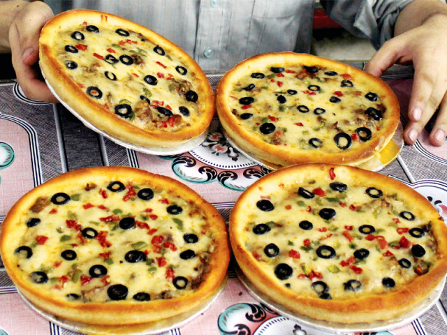 pizza is becoming more popular in peshawar but only two major joints offer it photo muhammad iqbal pizza is becoming more popular in peshawar but only two major joints offer it photo muhammad iqbal