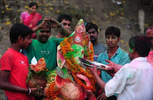 young people carrying idols often wade out deep into the waters and then fail to make it back to the banks and drown photo afp young people carrying idols often wade out deep into the waters and then fail to make it back to the banks and drown photo afp