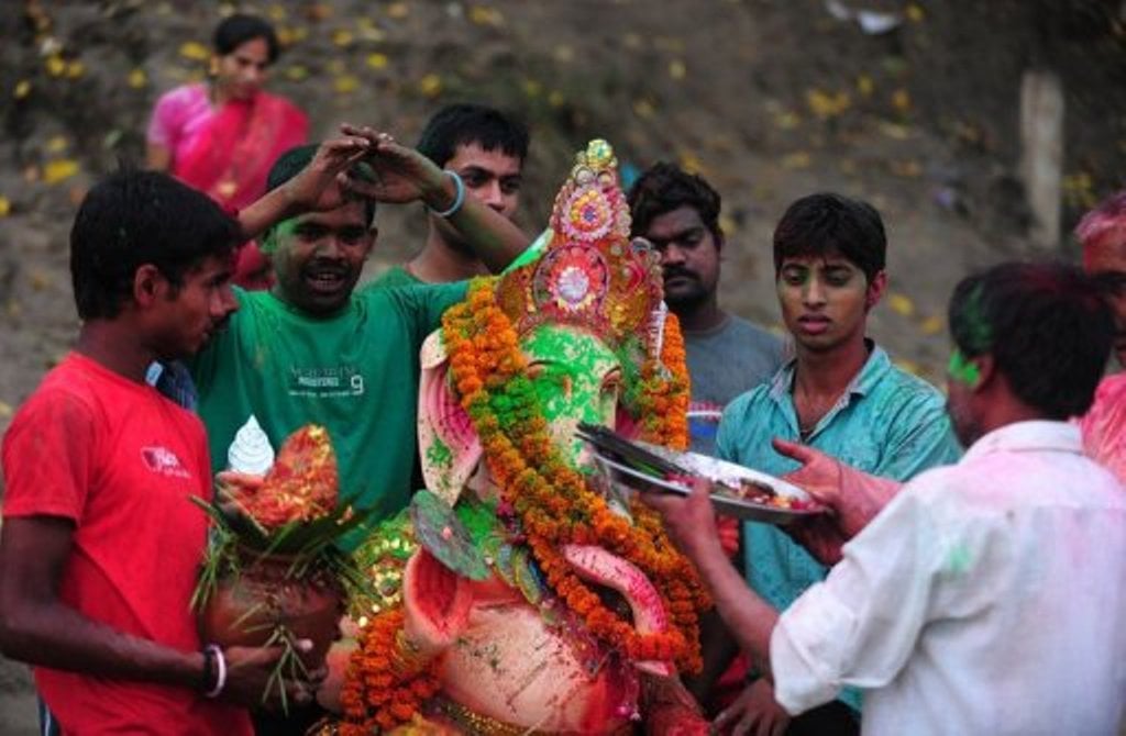 young people carrying idols often wade out deep into the waters and then fail to make it back to the banks and drown photo afp