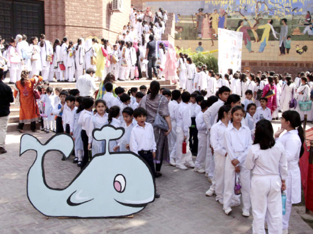 school children attending the festival queue up to watch a show photo shafiq malik express school children attending the festival queue up to watch a show photo shafiq malik express