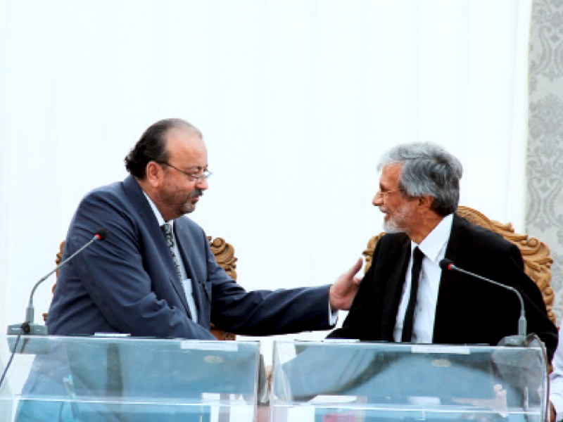acting governor agha siraj durrani congratulates shc cj maqbool baqar after his oath taking on friday photo ayesha mir express