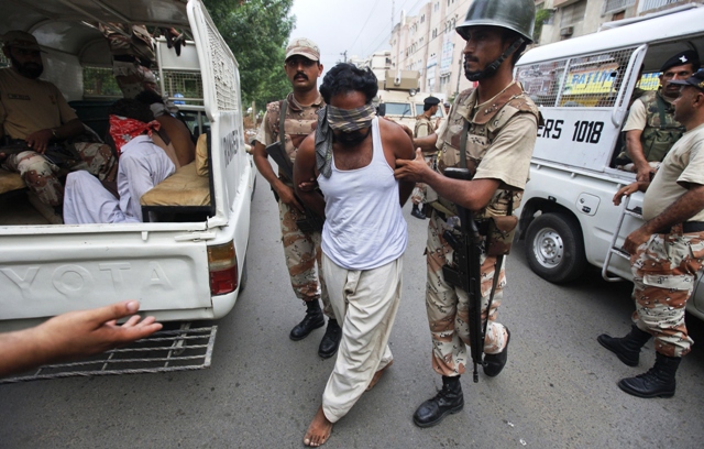 file photo of ranger personnel arresting suspects in karachi photo reuters file