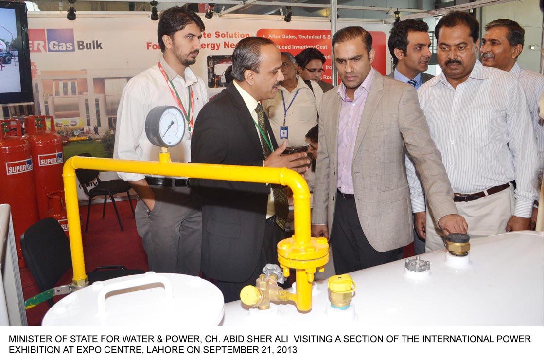 minister of state for water and power abid sher ali 2nd r visits a stall during the international power exhibition in lahore on saturday photo pid