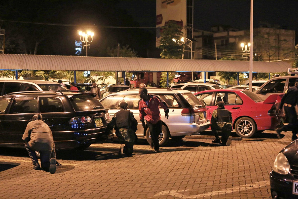 people run for cover as the stand off continues into the night at westgate shopping centre in nairobi september 21 2013 photo reuters