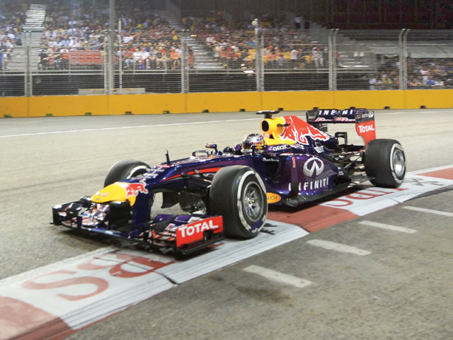 sebastian vettel took a huge step towards his fourth straight world title yesterday with a superlative victory in singapore photo afp sebastian vettel took a huge step towards his fourth straight world title yesterday with a superlative victory in singapore photo afp