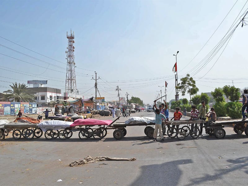 the christian community blocked the main road at essa nagri to protest against sunday s twin suicide bombing in peshawar photo rashid ajmeri express