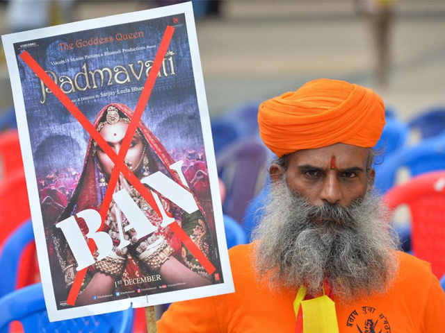 an activists of the karnataka wing of rashtriya rajput karni sena caste organisation holds a placard demanding the ban on screening of bollywood movie padmavati in bangalore photo afp