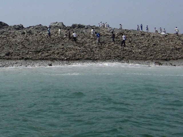 people scrambling to explore the new island photo afp file people scrambling to explore the new island photo afp file