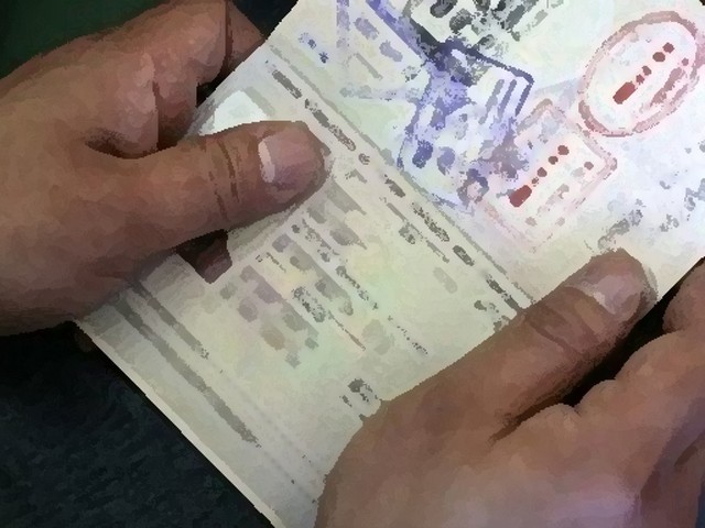 a file photo of a passport with visa stamps photo file