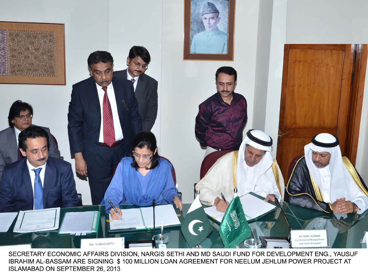 secretary economic affairs division nergis sethi l and saudi fund vice chairman r eng yausuf ibrahim al bassam sign the 100 million loan agreement for njhp photo pid