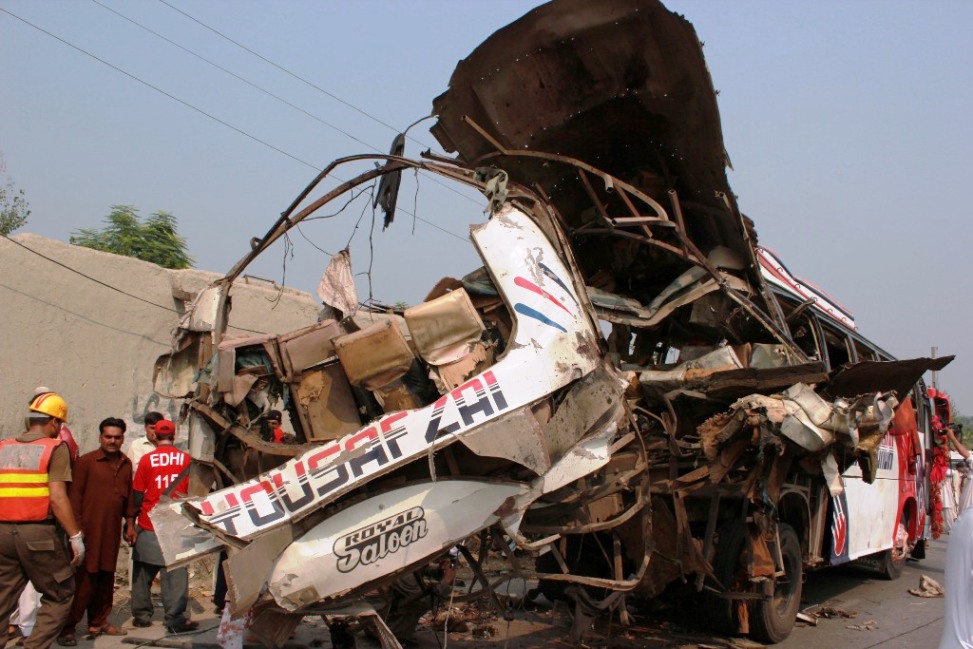 the back side of the damaged bus photo muhammad iqbal