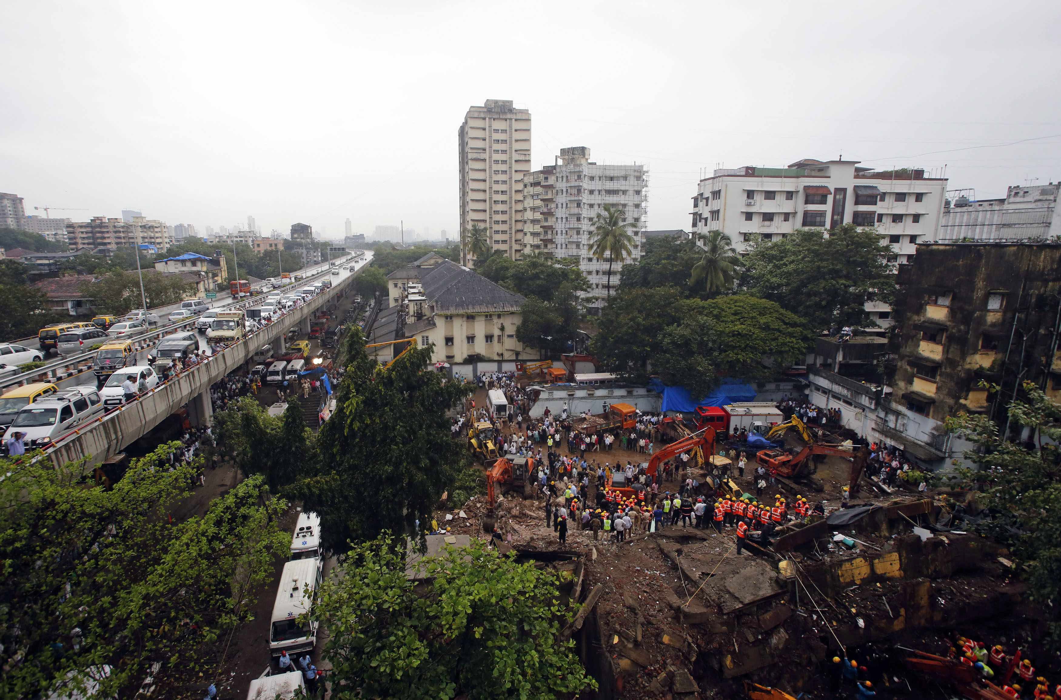 rescue crews search for survivors at the site of a collapsed residential building in mumbai september 27 2013 photo reuters