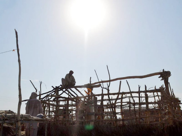 calamity hit people build homes from sticks and rags to save themselves from the scorching sun photo online calamity hit people build homes from sticks and rags to save themselves from the scorching sun photo online