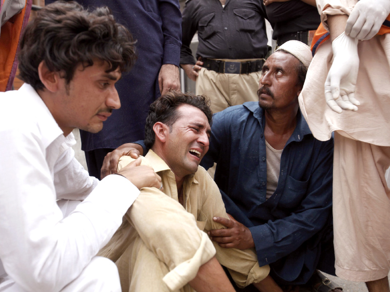 a man cries over the death of his brother at a hospital in peshawar photo reuters