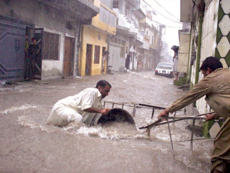 though the rain brought relief for heat stricken residents it caused havoc at several localities in rawalpindi photo muhammad javaid express tribune online