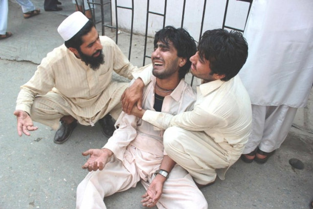 locals try to console a family member at the hospital after the qissa khwani attack photo muhammad iqbal express locals try to console a family member at the hospital after the qissa khwani attack photo muhammad iqbal express