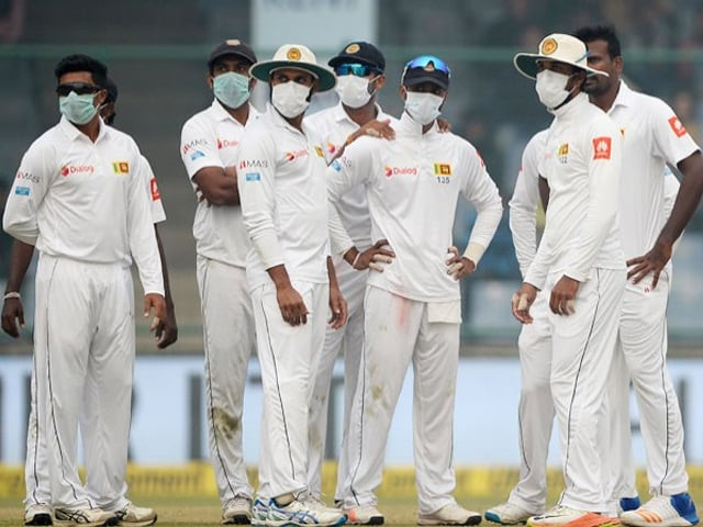 sri lanka cricket players wear masks in an attempt to protect themselves from air pollution during the second day of the third test cricket match between india and sri lanka at the feroz shah kotla cricket stadium in new delhi on december 3 2017 photo afp