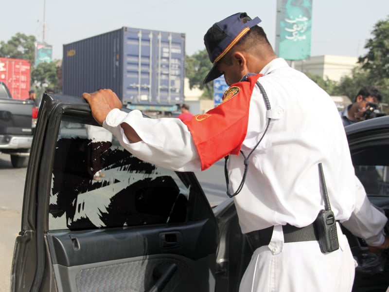 ngo ctac traffic police karachi police and the excise and taxation department held a rehearsal drive on monday starting today these officials will set up pickets across district south to check cars for their registration documents standardised licence plates and clear windows photo ayesha mir express