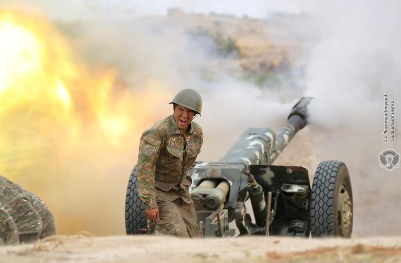 An ethnic Armenian soldier fires an artillery piece during fighting with Azerbaijan's forces in the breakaway region of Nagorno-Karabakh, September 29, 2020. PHOTO: REUTERS