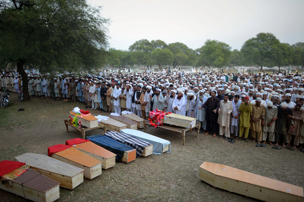 relatives and residents offer funeral prayers for blast victims in shabqader on september 29 2013 photo afp