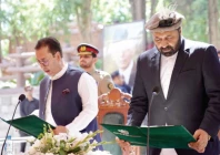 g b governor mehdi shah administers the oath of office to amjad hussain as region s new cm in gilgit photo ppi