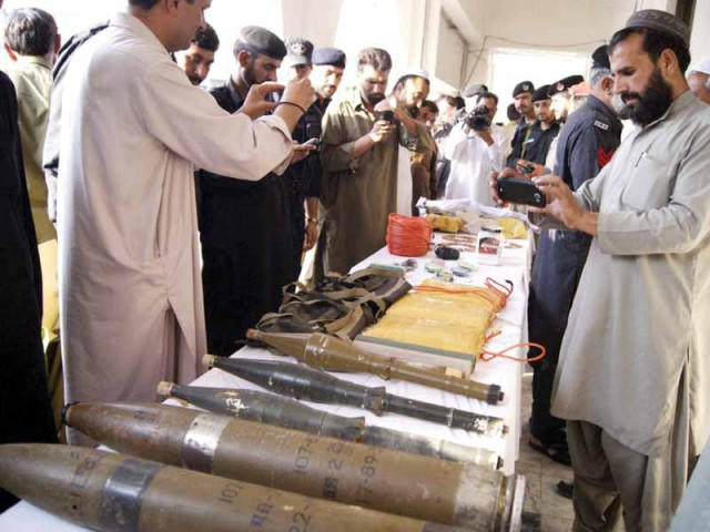 policemen displaying weapons recovered from members of the terrorist organisation amaraat e islami photo online policemen displaying weapons recovered from members of the terrorist organisation amaraat e islami photo online
