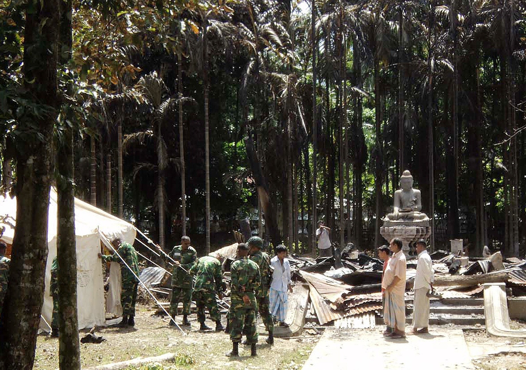 in the latest clashes a mob of hundreds of buddhists burned houses and stabbed a 94 year old woman to death photo afp file