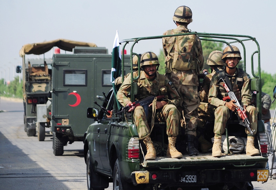 troops ride to areas in balochistan affected by an earthquake in military trucks in karachi on september 25 2013 photo afp