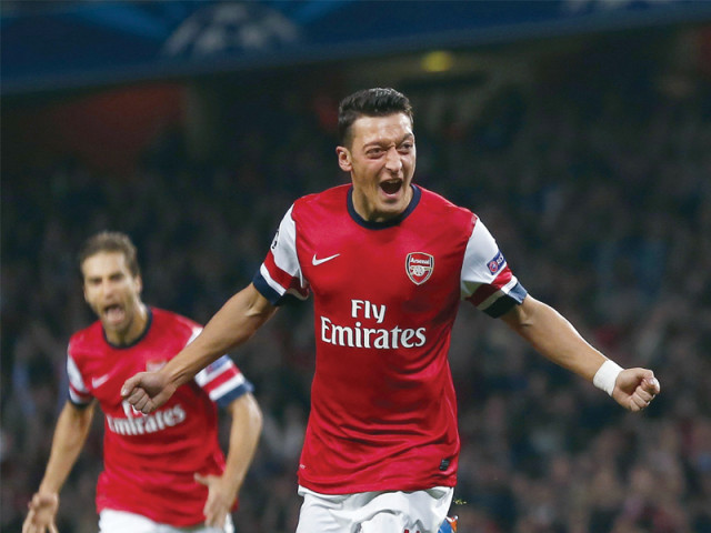 ozil scored his first goal for arsenal and assisted another to hand his side a dominant 2 0 win over serie a frontrunners napoli photo reuters ozil scored his first goal for arsenal and assisted another to hand his side a dominant 2 0 win over serie a frontrunners napoli photo reuters