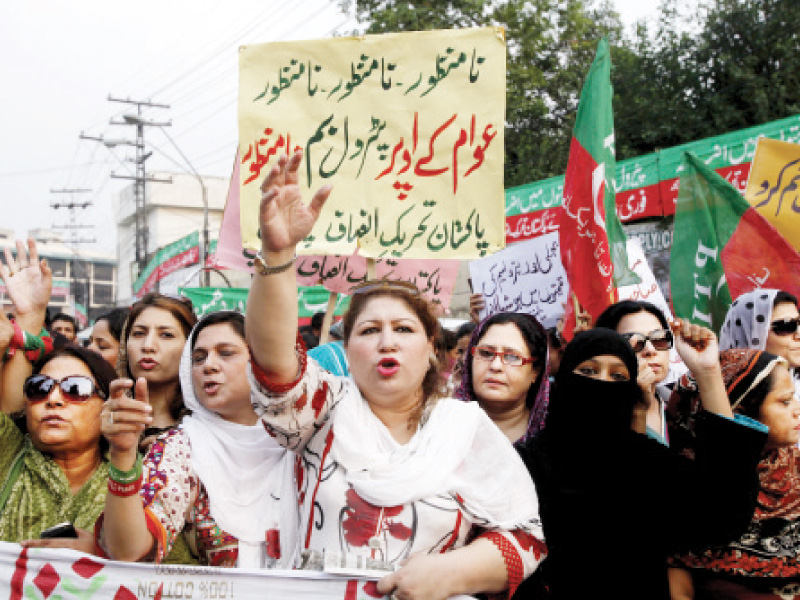 the protesters waved party flags and placards chanted slogans staged a sit in and cheered as pti leaders made speeches demanding the withdrawal of the pml nawaz government s decision to increase prices photo shafiq malik express