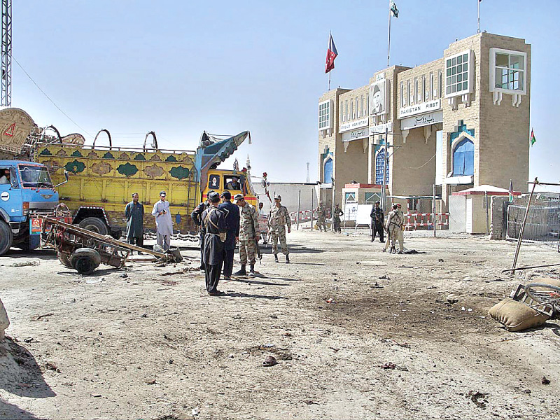 security forces inspect the site of suicide blast at the chaman border crossing photo app