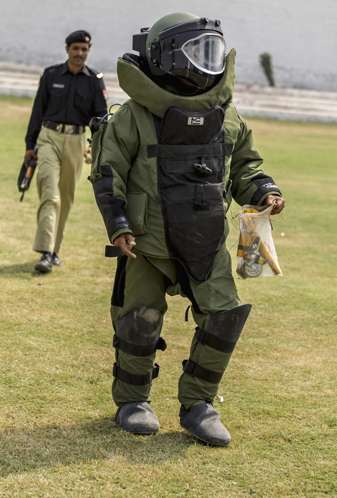 a technician from pakistan 039 s top bomb disposal unit walks after a demonstration at the unit 039 s headquarters in peshawar photo reuters
