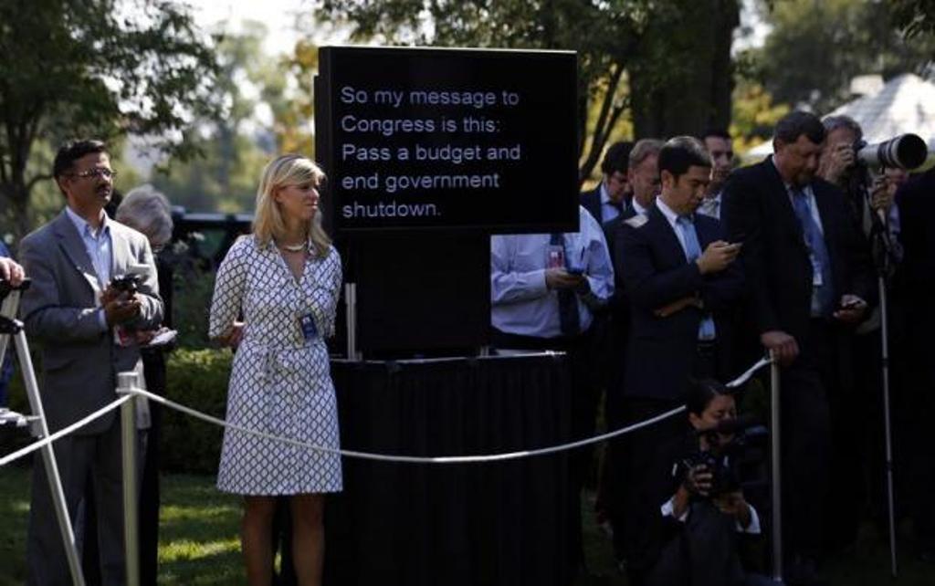 a teleprompter used by president obama to deliver remarks on the implementation of the affordable care act is shown among white house staff and journalists is seen in the rose garden of the white house october 1 2013 photo reuters