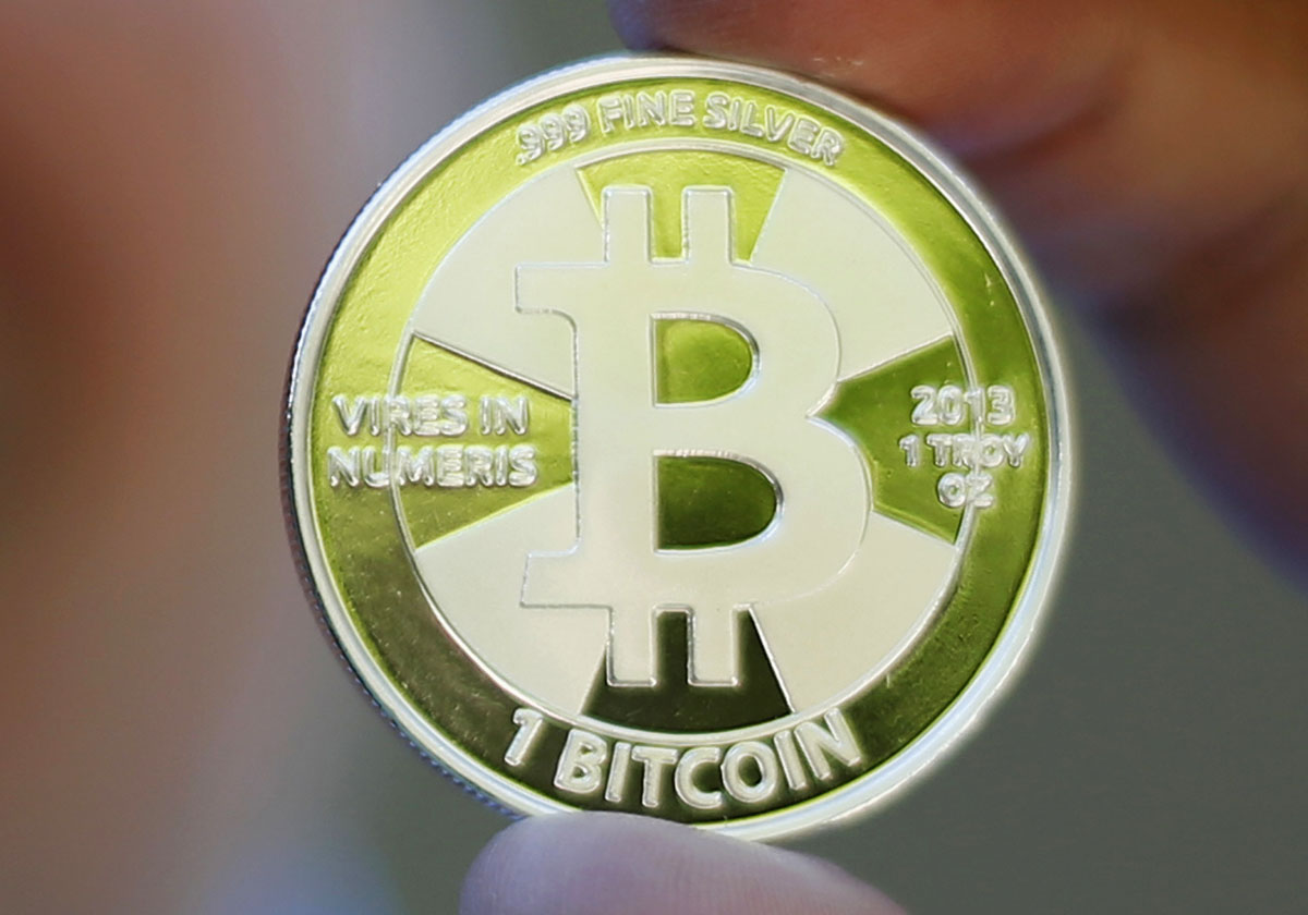 mockup of a bitcoin a virtual currency traded worldwide is held in this photo illustration in utah photo reuters