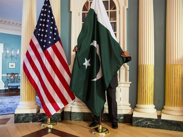 a state department contractor adjust a pakistan national flag before a meeting between u s secretary of state john kerry and pakistan 039 s interior minister chaudhry nisar ali khan in washington february 19 2015 photo reuters