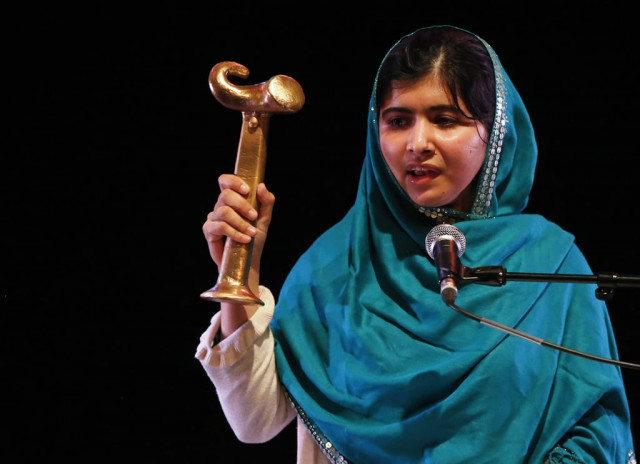 malala yousafzai waves her raw reach all women in war anna politkovskaya award while giving a speech after receiving the award at the southbank centre in london october 4 2013 photo reuters malala yousafzai waves her raw reach all women in war anna politkovskaya award while giving a speech after receiving the award at the southbank centre in london october 4 2013 photo reuters
