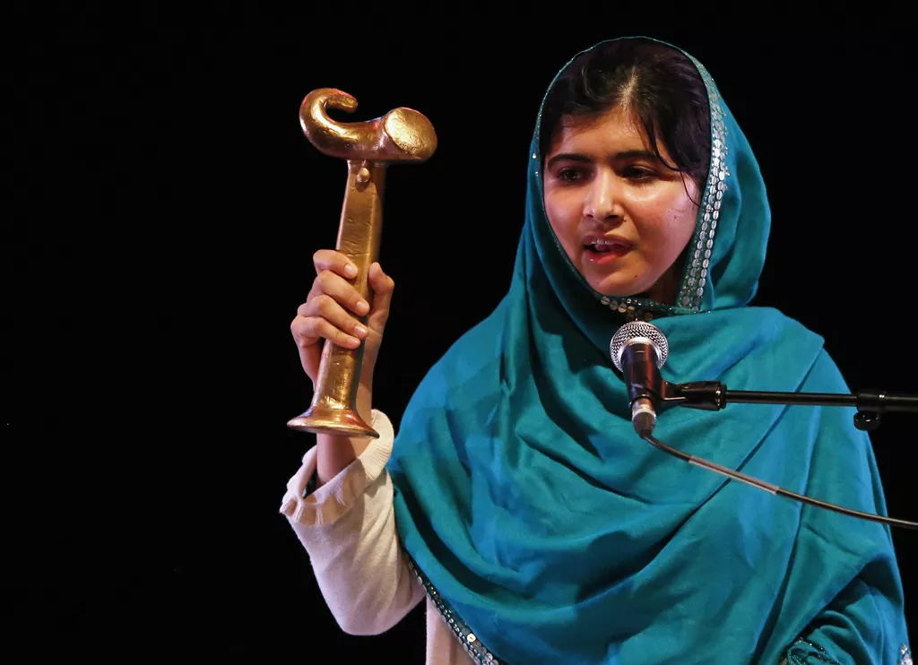 malala yousafzai waves her raw reach all women in war anna politkovskaya award while giving a speech after receiving the award at the southbank centre in london october 4 2013 photo reuters malala yousafzai waves her raw reach all women in war anna politkovskaya award while giving a speech after receiving the award at the southbank centre in london october 4 2013 photo reuters