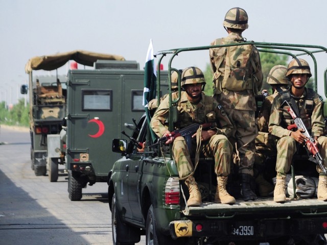 troops ride to areas in balochistan affected by an earthquake in military trucks in karachi on september 25 2013 photo afp file